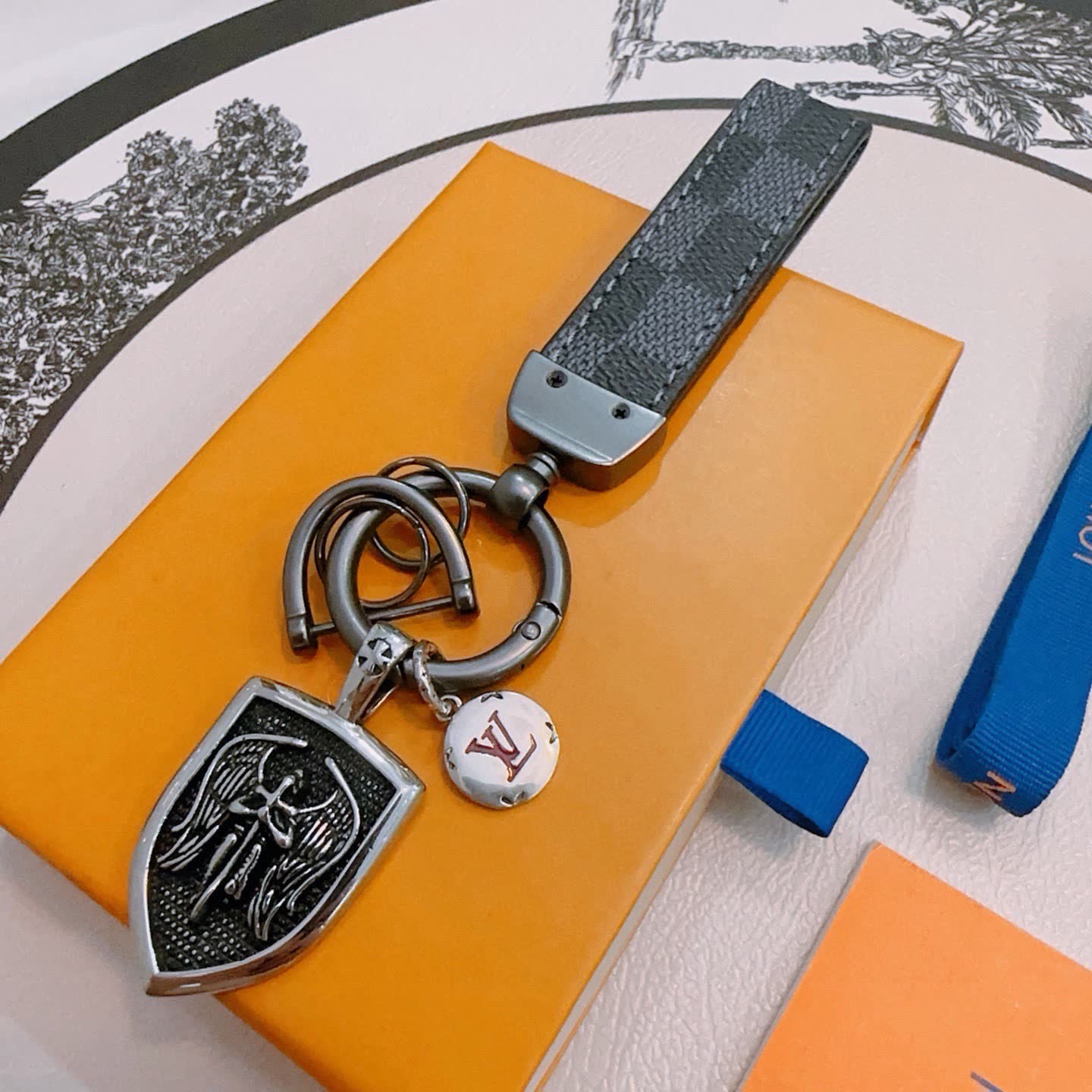 Louis Vuitton Keychain with Shield and Leather Strap